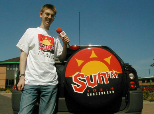Chris Stevens with Sun FM promotions car